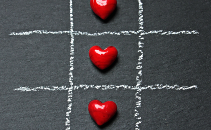 tic tac toe with red candy hearts. Is your heart hungry for love