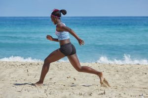 african-american woman running on the beach. God is calling