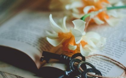 7 keys to overcome condemnation, keys and white and yellow flowers on a Bible